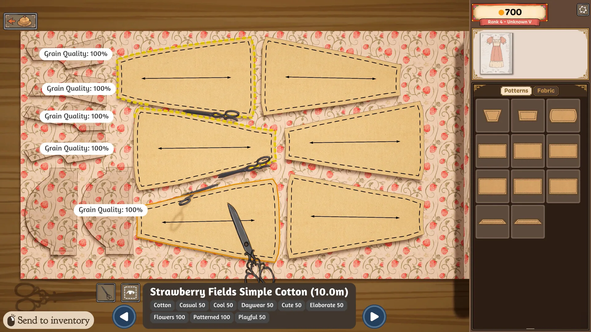 Paper pattern pieces on strawberry-print cotton with grain-quality indicators